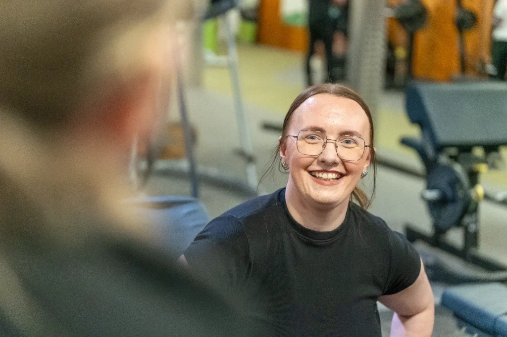 Woman smiling during a personal trainer assessment at Corringham leisure centre gym