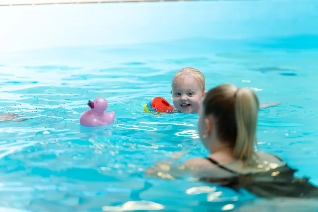 Mum and toddler enjoying a parent and child swimming session at an Impulse Leisure pool