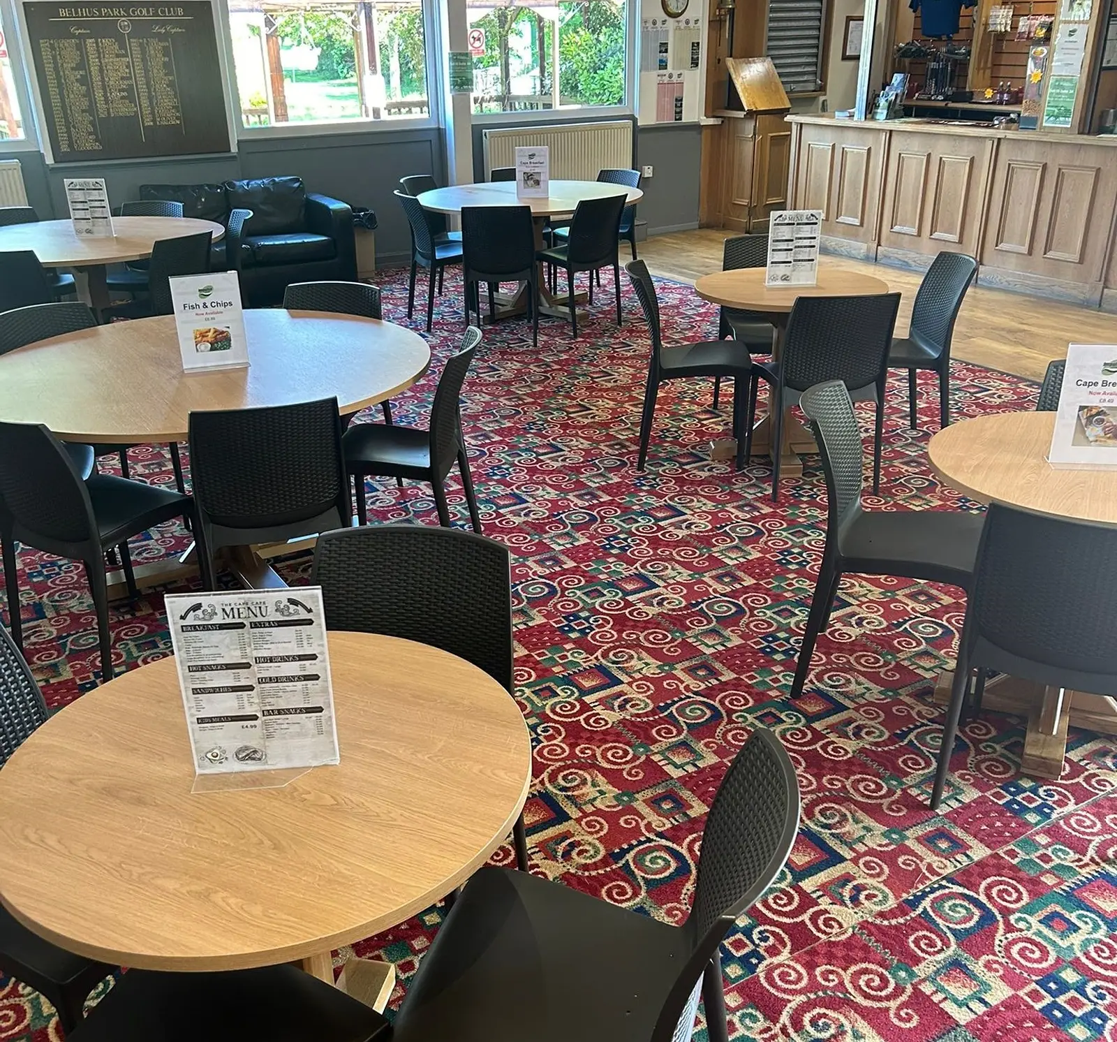 Bar area, with small circular table and chairs in Cape Bar at Impulse Leisure Golf Course.